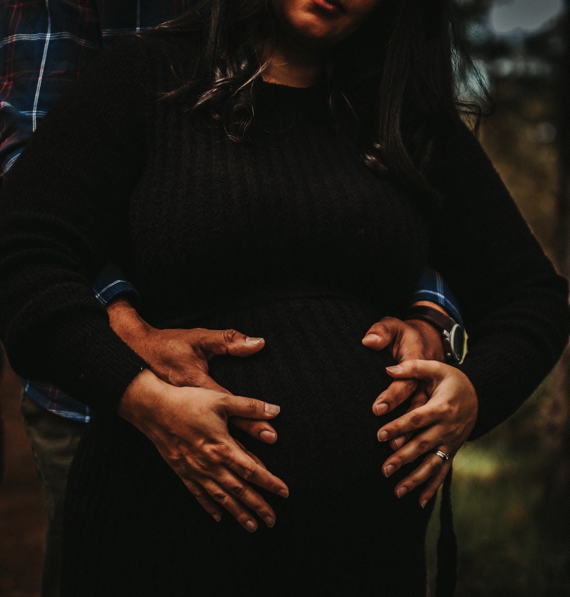 woman in black long sleeve shirt and black pants